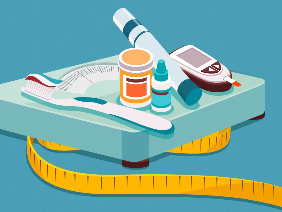 toothbrush, toothpaste, and various medicines on top of a scale