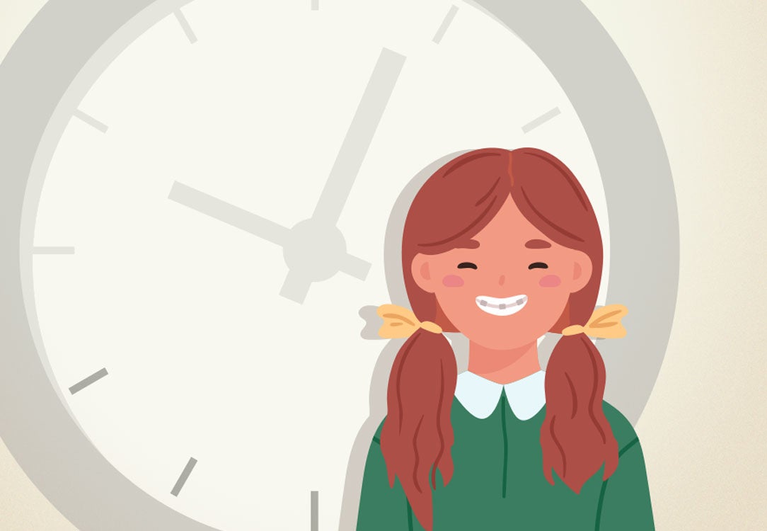 Teenager girl with braces standing in front of a faded gray clock on gray background