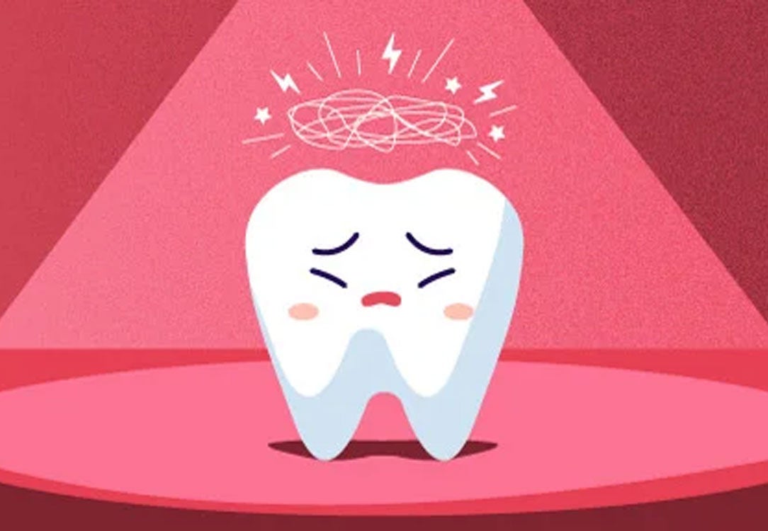 Stressed tooth under a spotlight with a red background