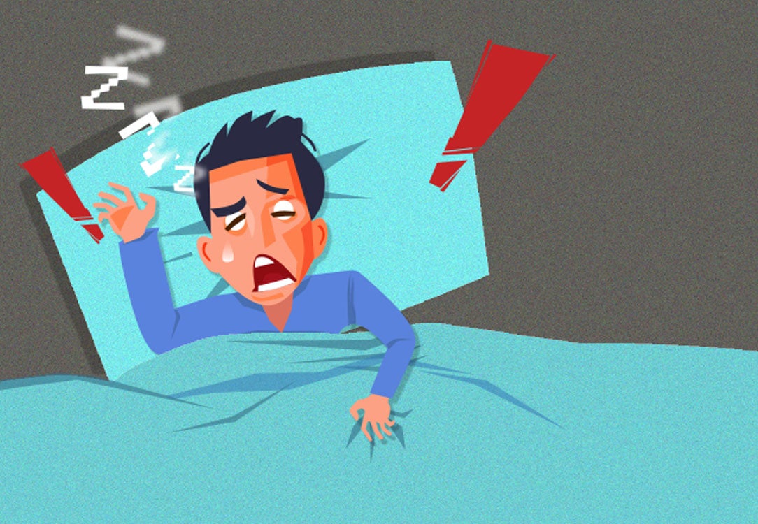 Man sleeping in bed with sleep apnea