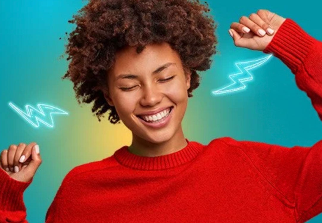 Lifestyle photo of woman wearing red sweater with lightning bolts