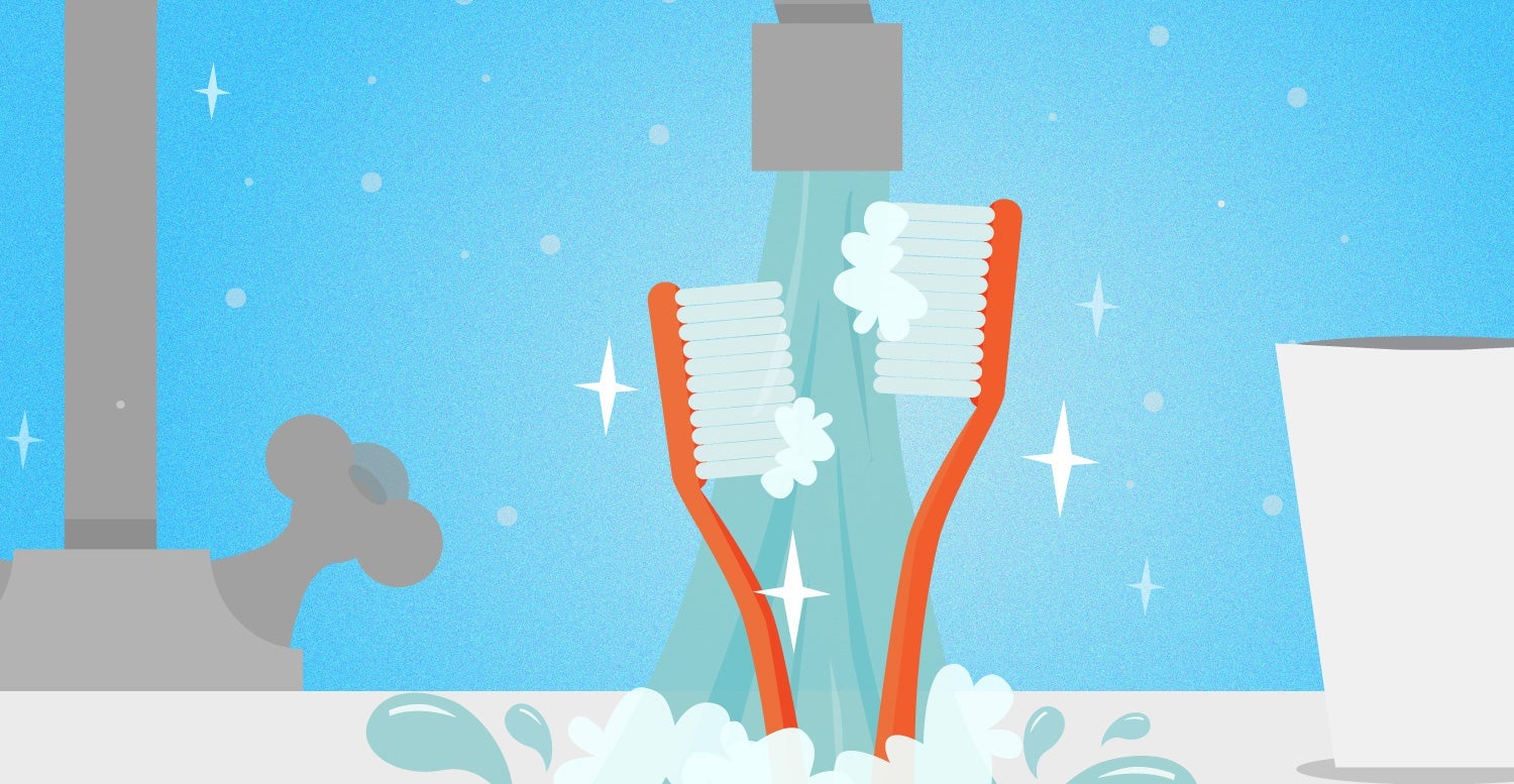 Toothbrushes getting washed by a stream of water