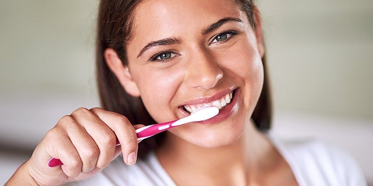 Person brushing teeth