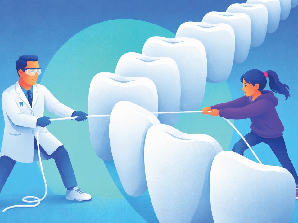 Dentist and patient flossing on opposite sides of teeth