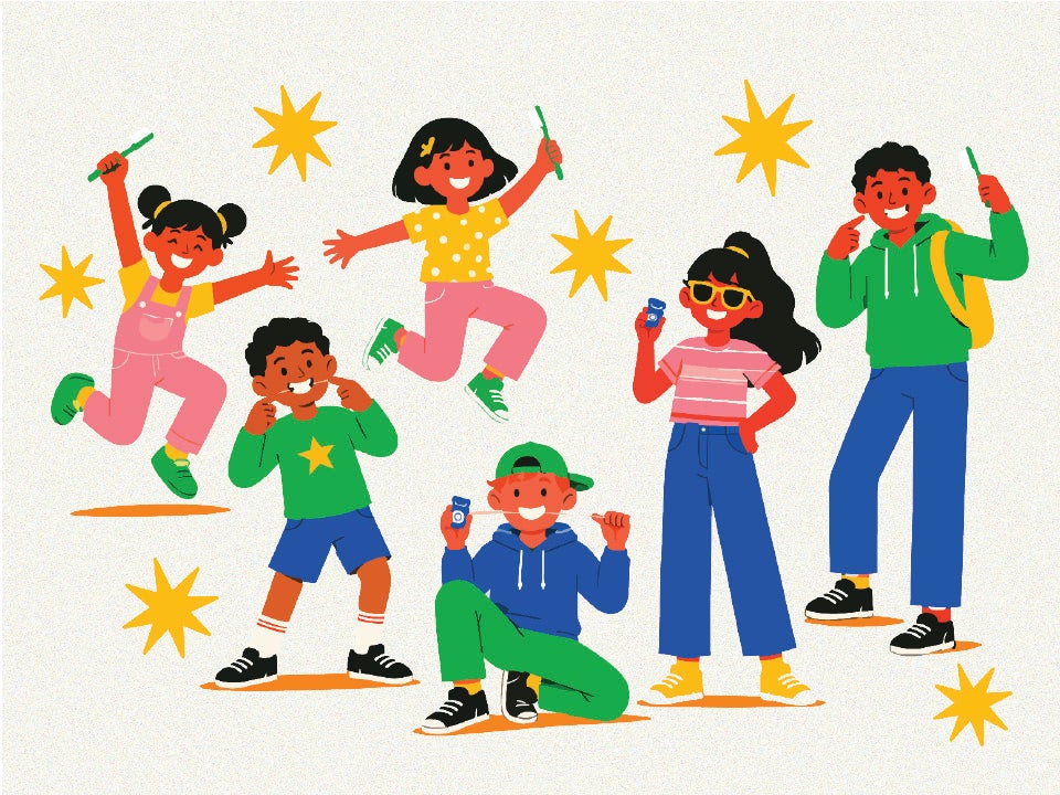 children from different age groups smiling with toothbrushes